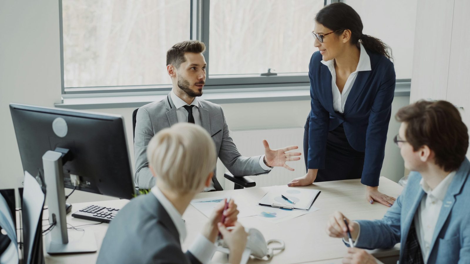 Colleagues collaborating around a business workflow
